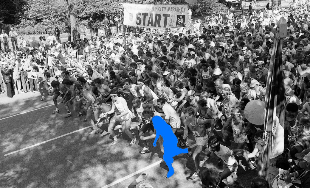 Archive photo: the 1970 start line in Central Park, a crowd of runners under a banner that says START, one runner shown as a blue silhouette