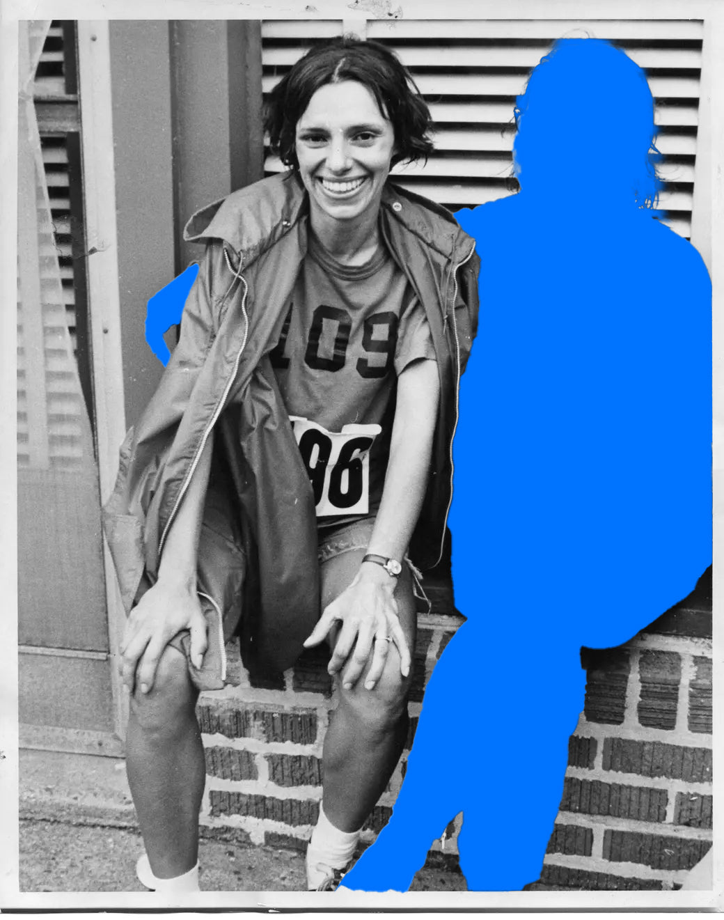 Archive photo: Nina Kuscsik, number 109, smiling on a wall after the 1972 race