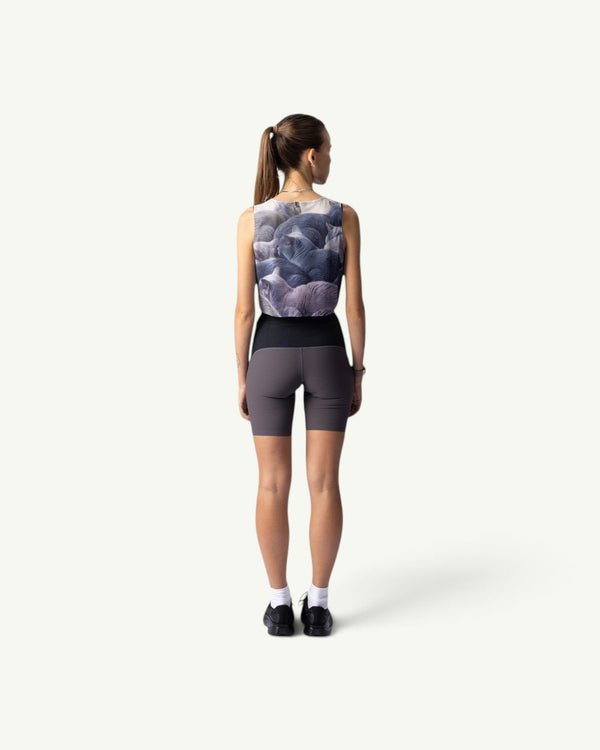 Amateur British Shorthair crop singlet with cat print, worn by a woman from the back with grey athletic shorts.