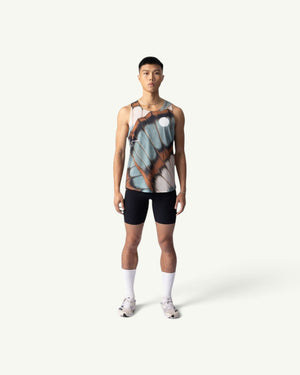 Amateur BUTTERFLY V2 SINGLET featuring a brown and blue butterfly wing print on lightweight moisture-wicking fabric.