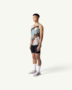 Amateur BUTTERFLY V2 SINGLET featuring a butterfly wing print on lightweight, moisture-wicking fabric on a male runner