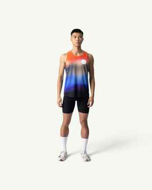 Amateur Dawn singlet featuring a sunrise gradient print on lightweight four-way stretch fabric worn by a male runner.