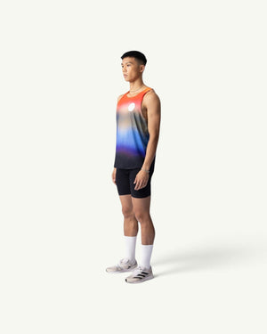 Amateur Dawn singlet featuring a sunrise gradient print on lightweight four-way stretch fabric, worn by a male runner.
