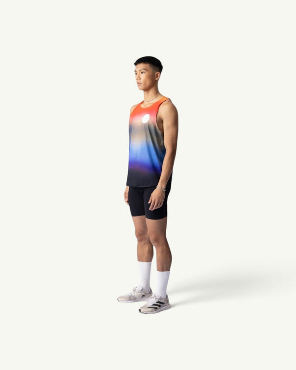 Amateur Dawn singlet featuring a sunrise gradient print on lightweight four-way stretch fabric, worn by a male runner.