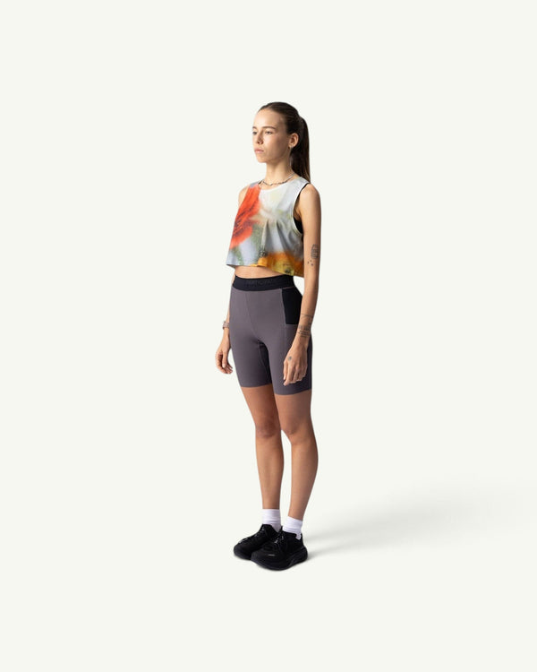 Amateur Frosted Glass crop singlet with a soft-focus abstract print worn by a model in a side profile view