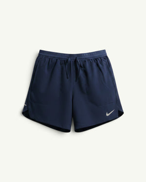 Nike ACG navy blue 5-inch 2-in-1 running shorts with a supportive inner liner, drawstring waist, and reflective logo.