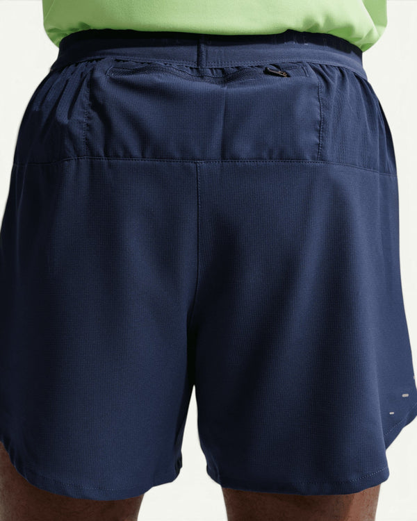 Nike Men's Stride 5-inch 2-in-1 running shorts in navy blue with a zippered back pocket and reflective details.