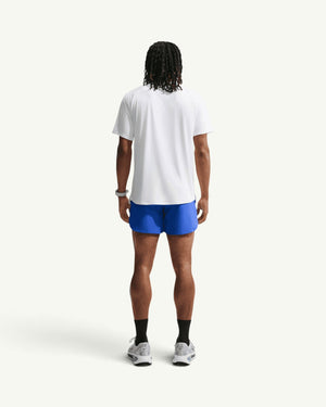 Nike men's blue 5-inch stride training shorts with brief liner worn by a model from the back view