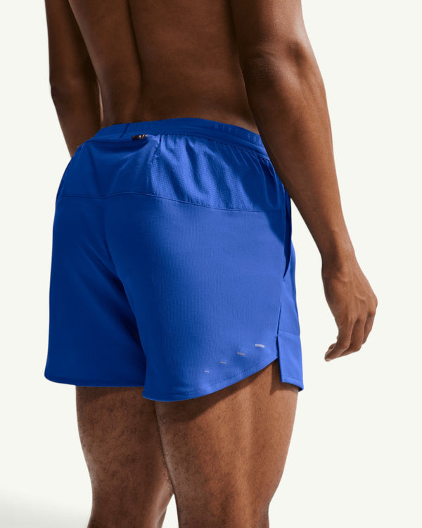 Amateur men's blue Nike Stride 5-inch training shorts with brief liner and reflective details, back view