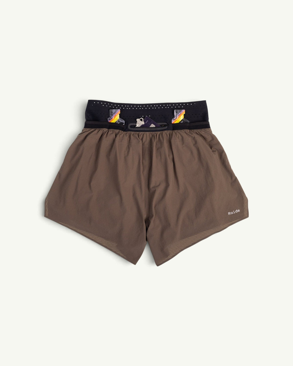 Raide Men's TrailTech 5-inch mountain running shorts in brown with a black waistband and reflective logo detail.