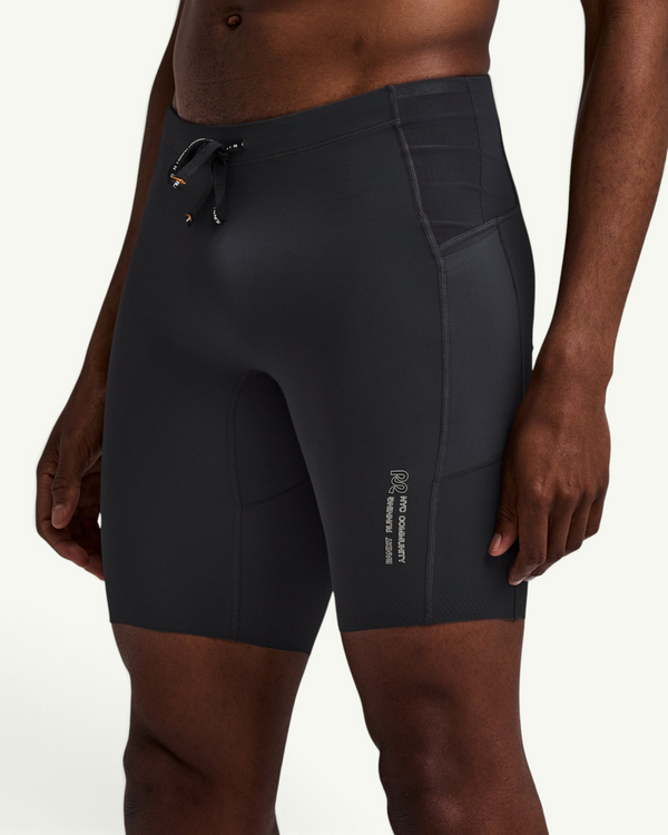 The half tight for race day and hard efforts. Stamina compression supports the legs and moves with every stride. The ribbed build with extra mesh adds stretch and hold at pace. A men's compression fit built to lock in and go fast.