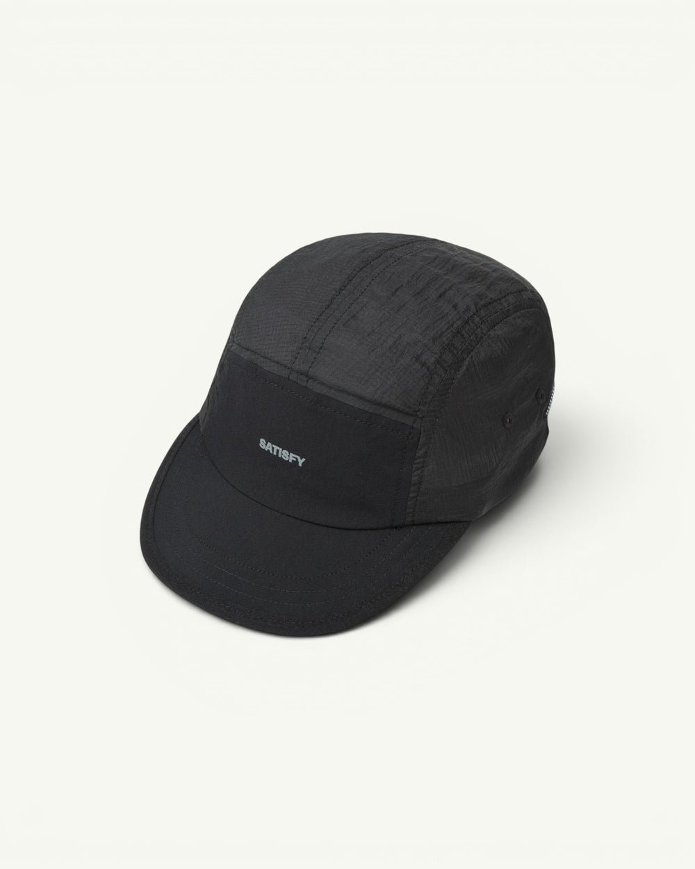 The trail cap that disappears. Ultralight, water-repellent Rippy ripstop from Italy with a SilverShell brim that reflects heat back where it came from. A short brim that won't soak up sweat, a stretch front panel that takes a headlamp, and a bungee cord for a locked-in fit. One size, all conditions.