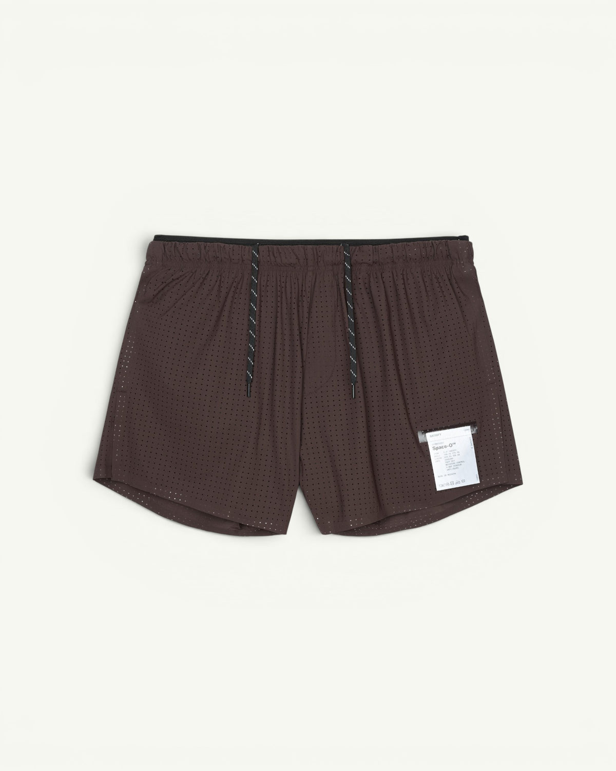 Shorts for going fast with next to nothing on. A 2.5-inch Space-O shell over an anti-chafe Justice technical-silk brief. The double waistband tucks the drawcords, hides a sweatproof phone pocket and carries a mini S-Carabiner for keys. Bonded seams, no rub. Race-short freedom with daily-run utility.