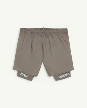 The long short for every run. A silky TechSilk shell from France over a Justice coldblack liner that blocks UV and holds a phone up to full size. Zippered back pocket for cargo, double waistband, bonded seams, reflective print for low light. Eight inches of coverage that still moves like silk.