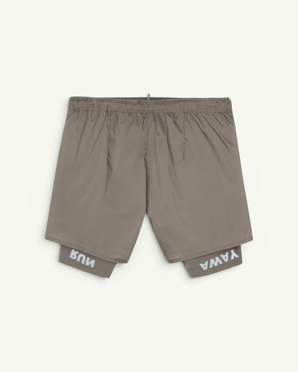 The long short for every run. A silky TechSilk shell from France over a Justice coldblack liner that blocks UV and holds a phone up to full size. Zippered back pocket for cargo, double waistband, bonded seams, reflective print for low light. Eight inches of coverage that still moves like silk.