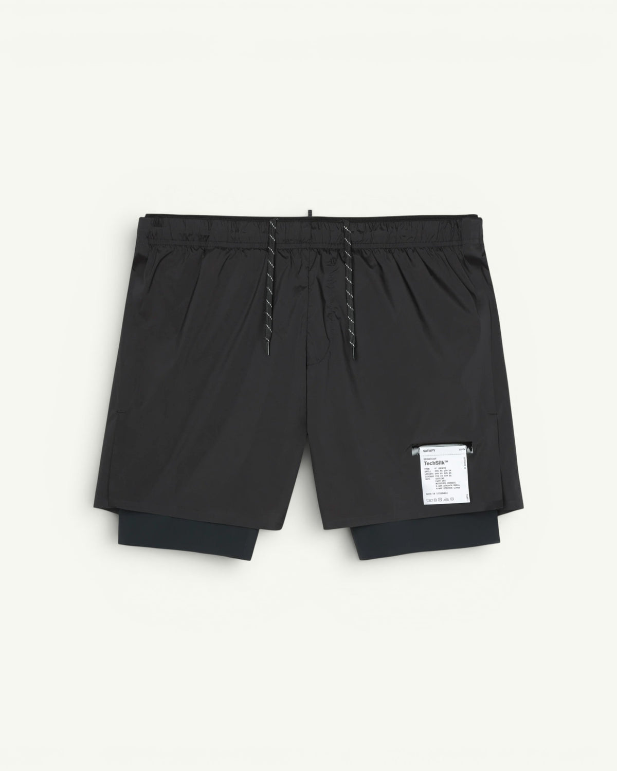 The long short for every run. A silky TechSilk shell from France over a Justice coldblack liner that blocks UV and holds a phone up to full size. Zippered back pocket for cargo, double waistband, bonded seams, reflective print for low light. Eight inches of coverage that still moves like silk.