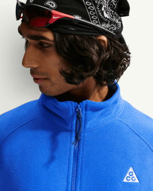 Nike ACG WOLF TREE full-zip jacket in bright blue Polartec fleece with high collar and embroidered logo detail