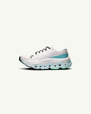 On Women's Cloudmonster 3 Hyper running shoe in white with teal accents, featuring a thick CloudTec sole.
