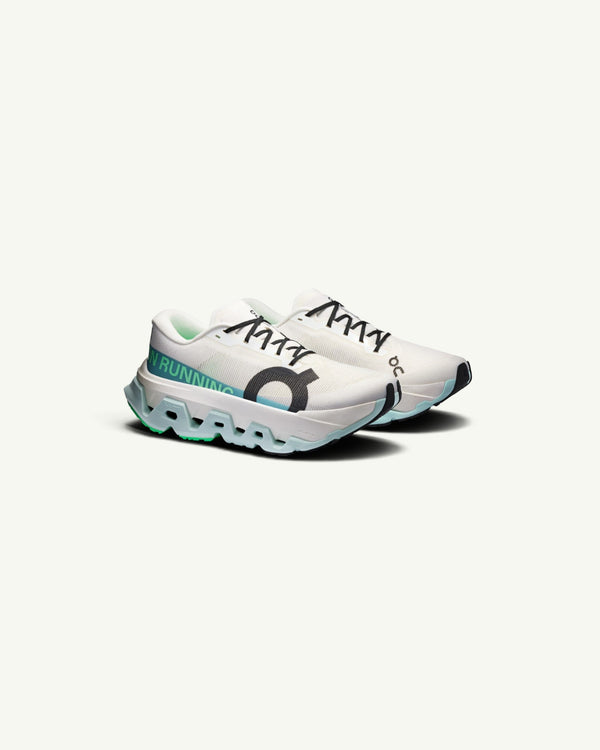 On Women's Cloudmonster 3 Hyper running shoe in white with teal accents and thick Helion superfoam sole