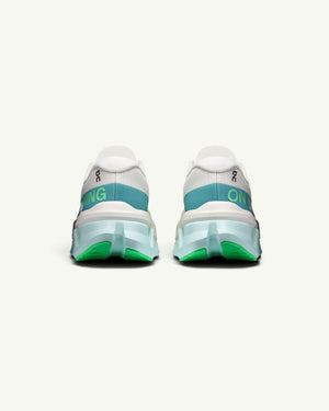 On Women's Cloudmonster 3 Hyper running shoes in white with teal and green accents, rear view