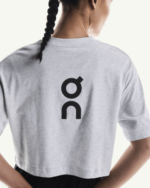 On Women's Club Boxy-T in light grey heather cotton blend with a black logo on the back