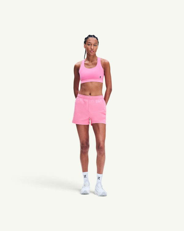 On Women's Core Bra in bright pink, a soft, seam-minimal sports bra for light-to-medium support.