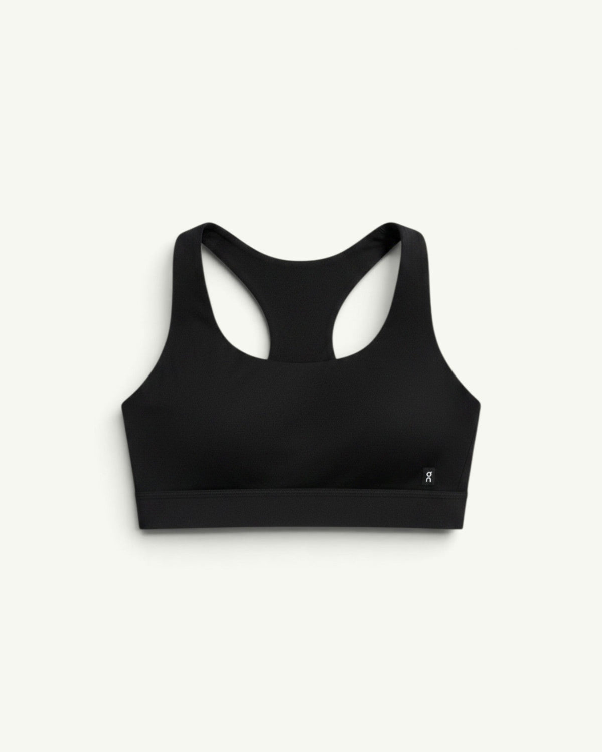 On Women's Core Bra in black with a racerback design, offering light-to-medium support for daily activities.