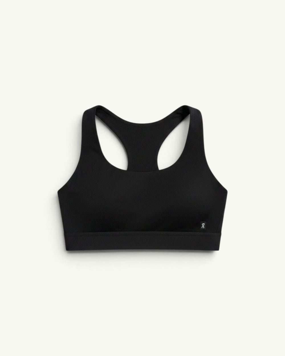 On Women's Core Bra in black with a racerback design, offering light-to-medium support for daily activities.