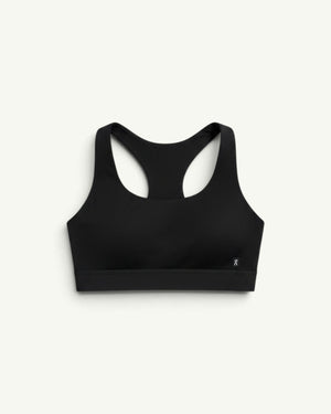 On Women's Core Bra in black with a racerback design, offering light-to-medium support for daily activities.