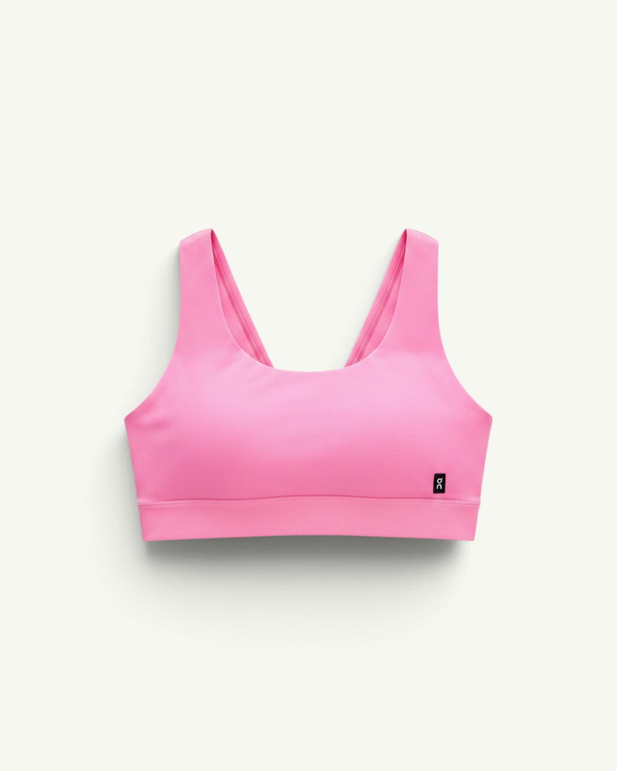 On Women's Core Bra in bright pink, a soft and seamless sports bra designed for light-to-medium support.