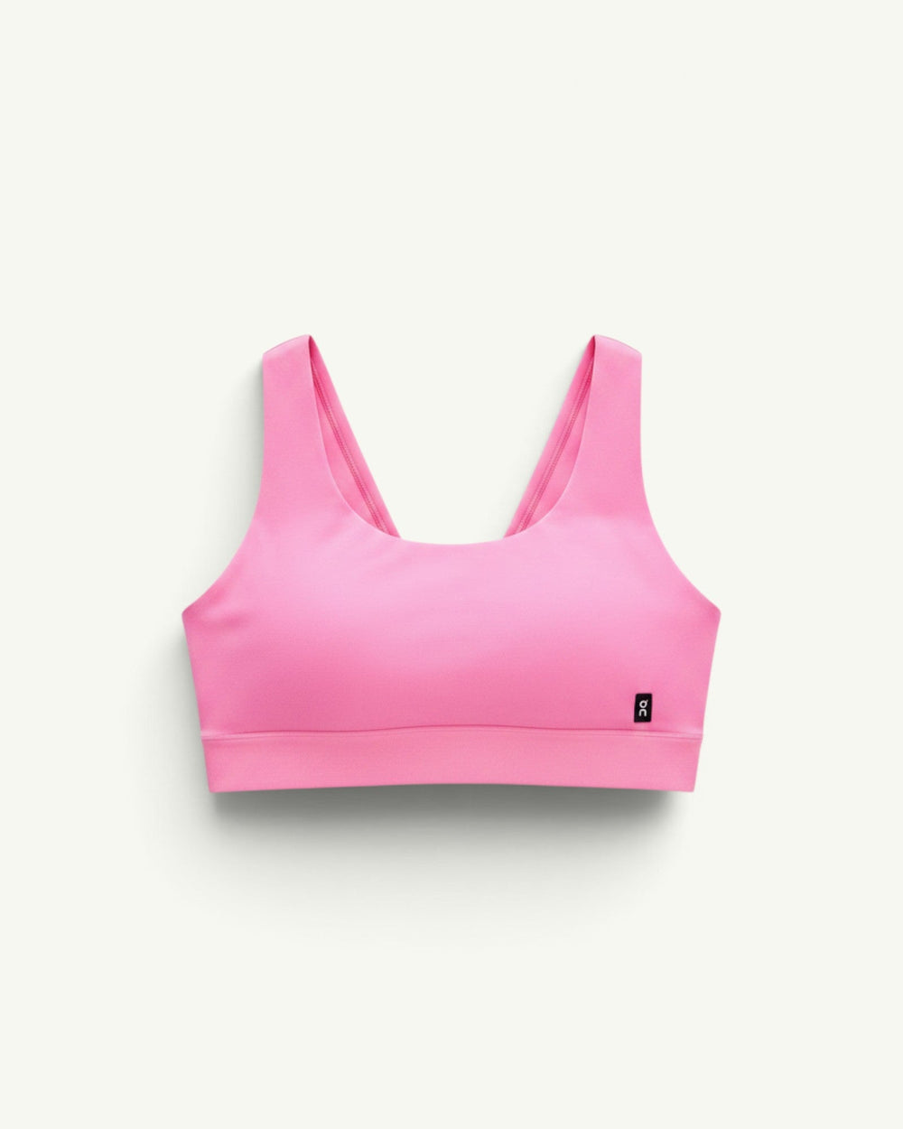 On Women's Core Bra in bright pink, a soft and seamless sports bra designed for light-to-medium support.