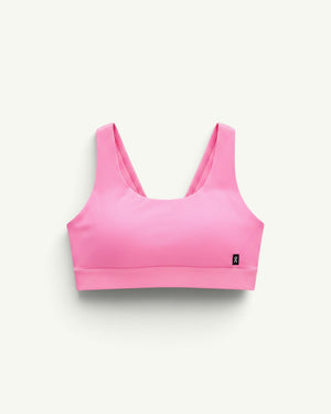 On Women's Core Bra in bright pink, a soft and seamless sports bra designed for light-to-medium support.