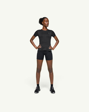 On women's black performance running t-shirt with athletic fit and technical fast-drying fabric on a model