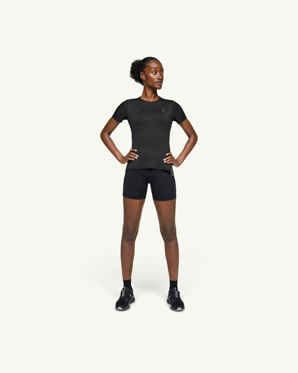 On women's black performance running t-shirt with athletic fit and technical fast-drying fabric on a model