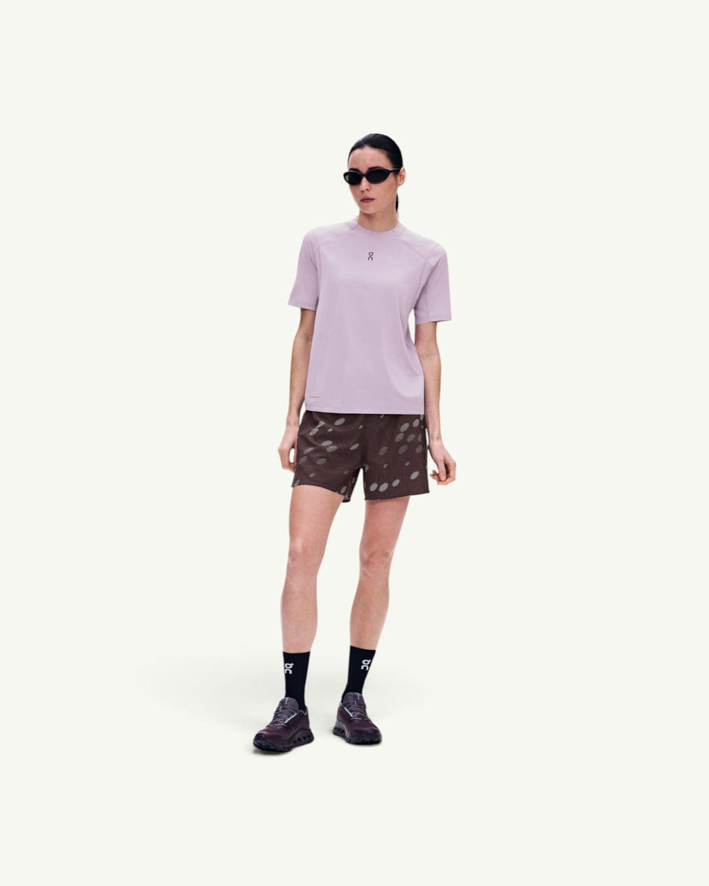 On Women's Trail-T Solar short-sleeve hiking shirt in light lavender with UV protection and breathable fabric.