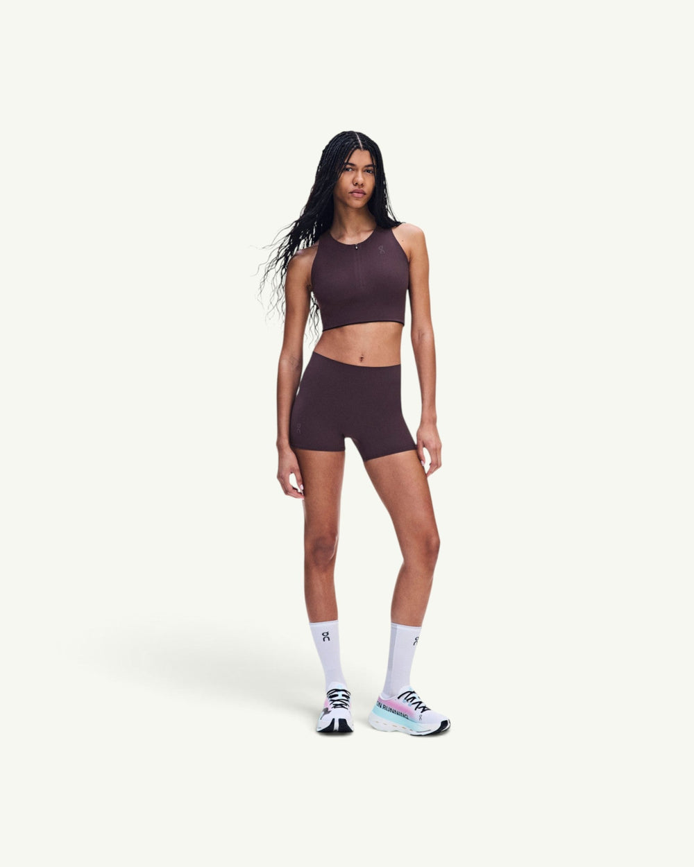 On Women's Zero short tights in deep burgundy, featuring ultralight fabric and minimal seams for race day.