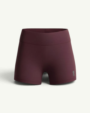 On Women's Zero short tights in deep burgundy, featuring ultralight fabric and minimal seams for race day.