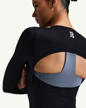 Amateur women's black GeoMesh long sleeve training top featuring a half-moon back cutout and bonded seams.