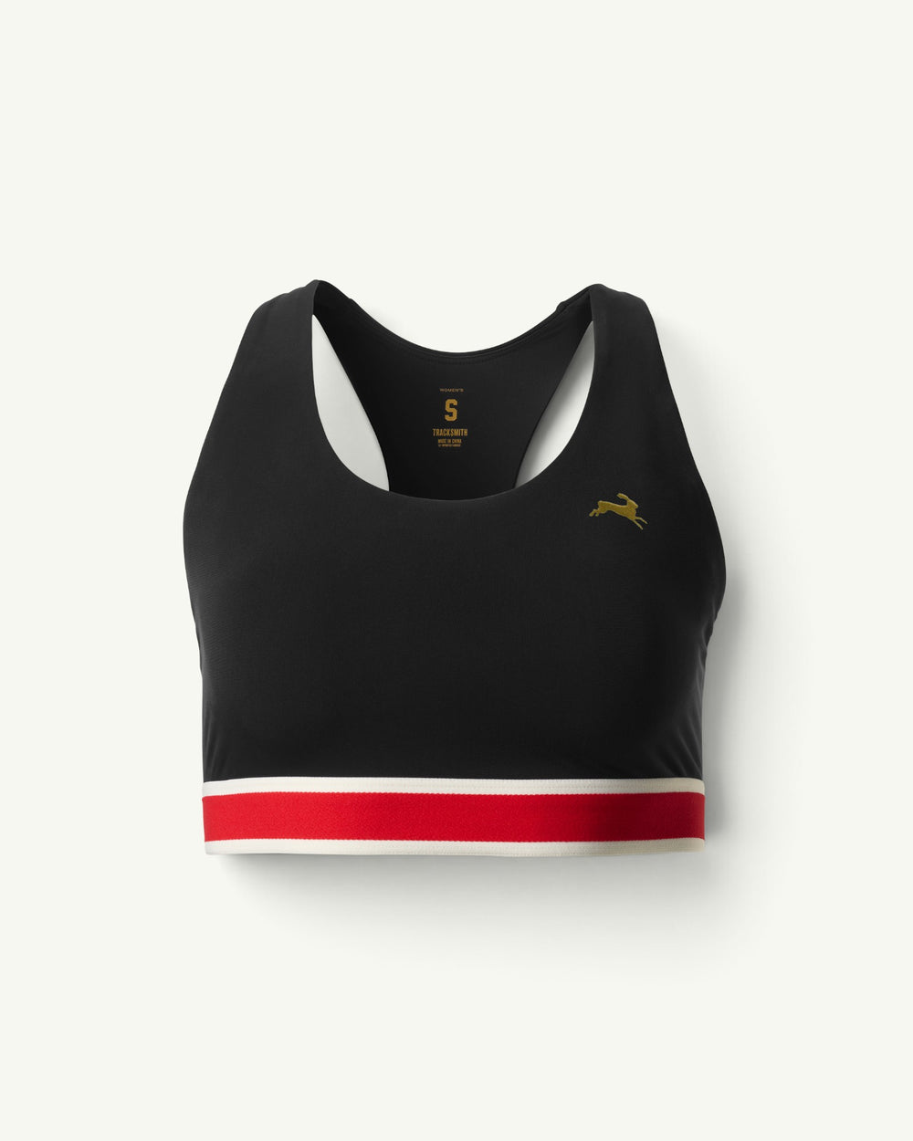 Amateur women's black racerback running bra with medium-impact support, gold hare logo, and red and white hem band.