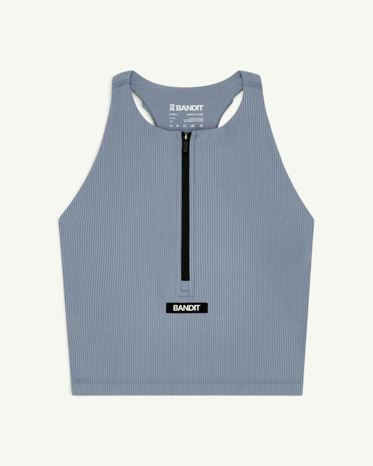 Amateur women's blue ribbed zip-front race crop top with T-back design and Bandit logo patch