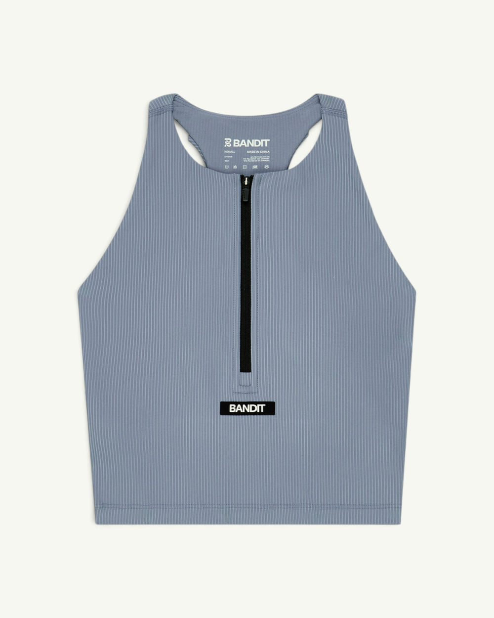 Amateur women's blue ribbed zip-front race crop top with T-back design and Bandit logo patch