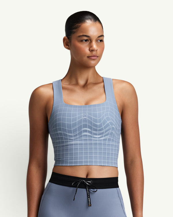 Amateur women's blue square neck race crop top with grid pattern, featuring smooth fabric and athletic fit.