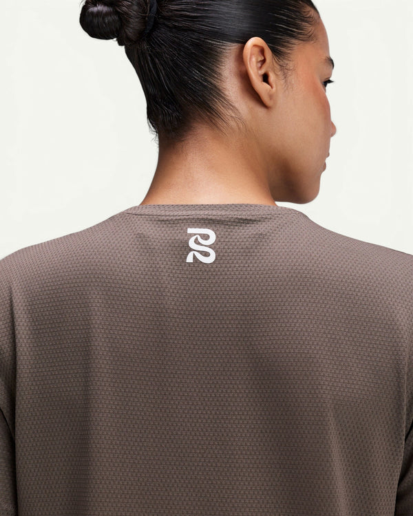 Amateur women's brown Micromesh cropped run tee with a crew neckline and reflective logo on the back