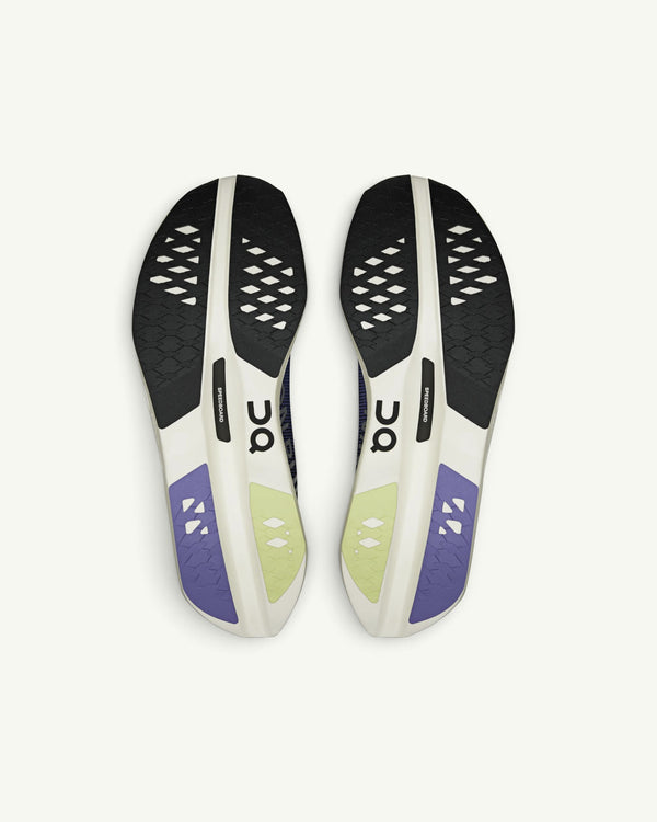 Amateur Men's Cloudboom Volt carbon-plated racing shoe outsoles featuring Helion HF foam in white, black, and purple.