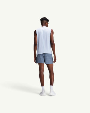 Amateur men's CoolGrid 5-inch running shorts in grey, worn by a model from behind with a light blue tank top.