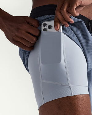Amateur men's CoolGrid 5-inch running shorts in grey with a moisture-wicking liner featuring a waterproof phone pocket.
