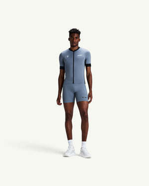 Amateur men's grey Gridlock quarter tights with compressive fit, moisture-wicking fabric, and multiple storage pockets.