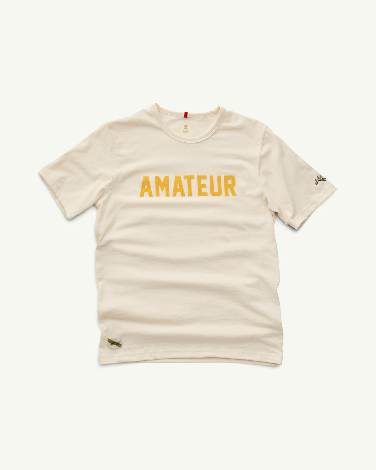 Amateur ivory cotton t-shirt with yellow graphic text and small rabbit logo on the sleeve