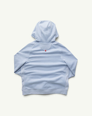 Amateur women's light blue midweight cotton-rich french terry hoodie, back view with small red and white logo detail.