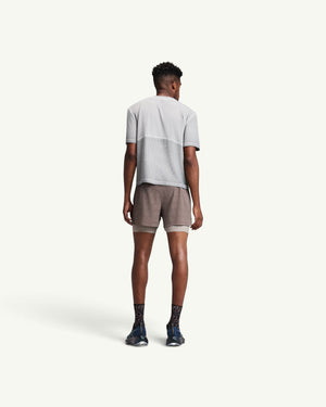 Amateur men's 2-in-1 CoolGrid running shorts in brown with integrated wicking liner, worn by a model from behind.